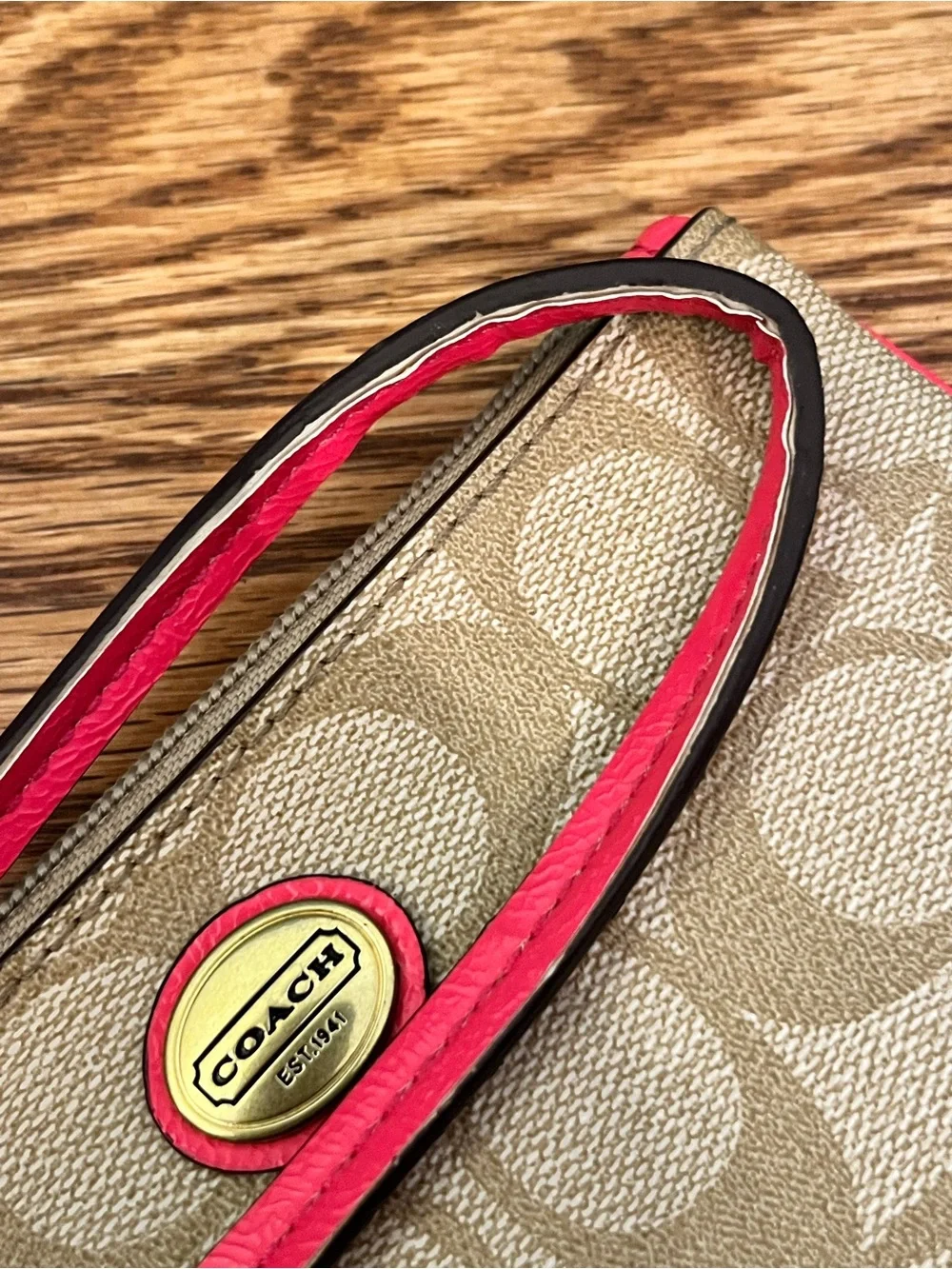 Coach Signature Canvas Wristlet with Coral Trim and Gold Hardware